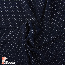 NATASHA. Drape crêpe fabric. Normally used for flamenco dresses. Micro polka dot print.